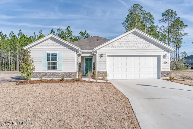 single story home featuring stone siding, driveway, and a garage