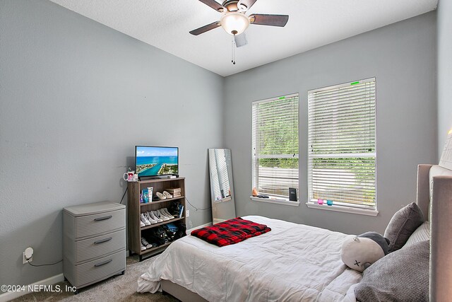 bedroom featuring ceiling fan and carpet floors