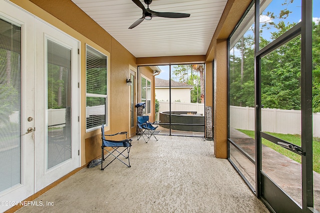 sunroom / solarium with ceiling fan