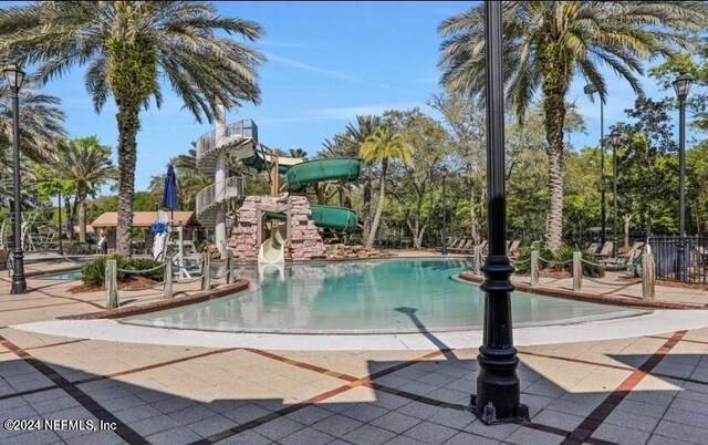 view of swimming pool featuring a water slide