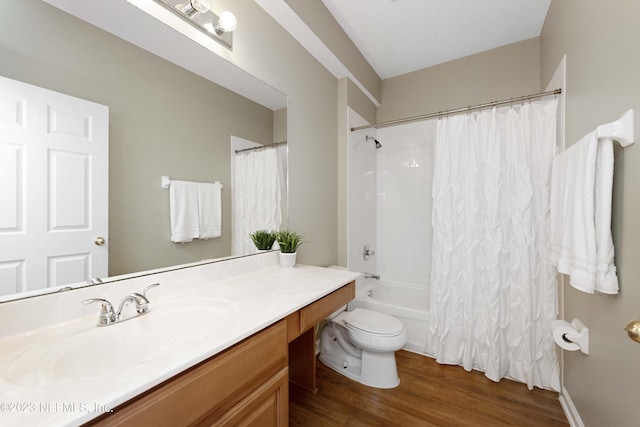 full bathroom with wood-type flooring, shower / tub combo with curtain, vanity, and toilet