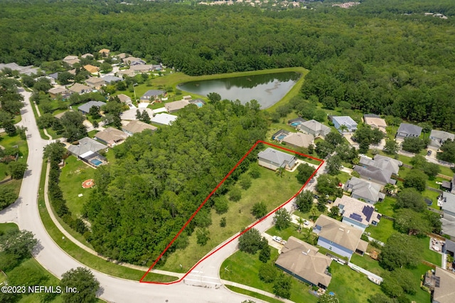 birds eye view of property featuring a water view