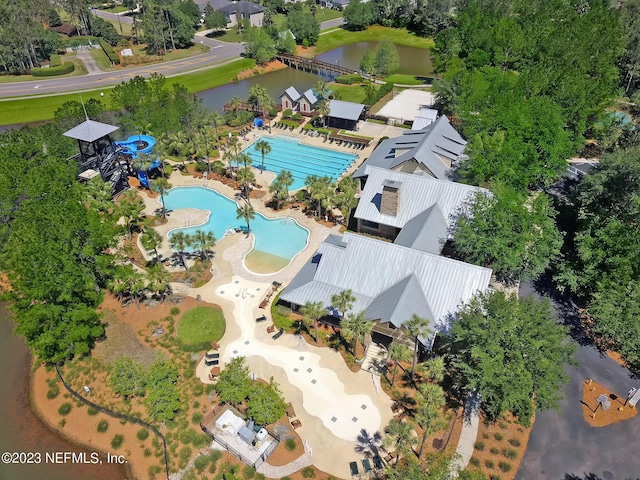 birds eye view of property with a water view