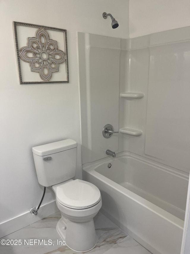 bathroom with toilet and shower / washtub combination