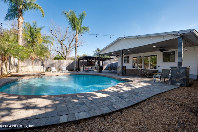 view of pool with a patio area and ceiling fan