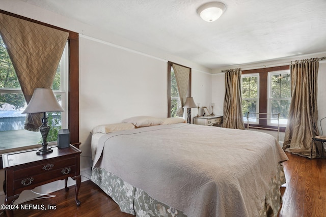 bedroom with wood-type flooring