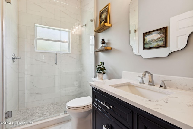 bathroom featuring vanity, toilet, and walk in shower