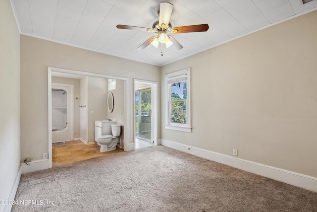 unfurnished bedroom featuring ceiling fan and carpet flooring