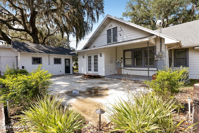 rear view of property with french doors