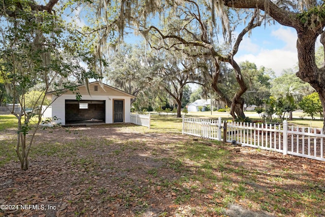 view of yard with an outbuilding and a garage