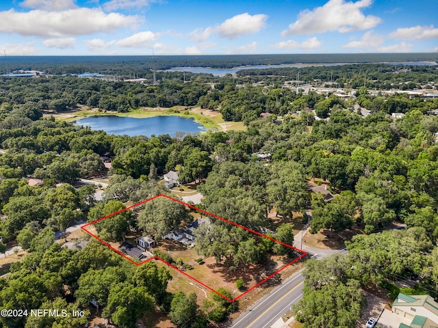 birds eye view of property with a water view