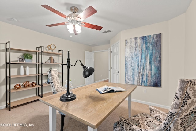 home office featuring ceiling fan and light colored carpet