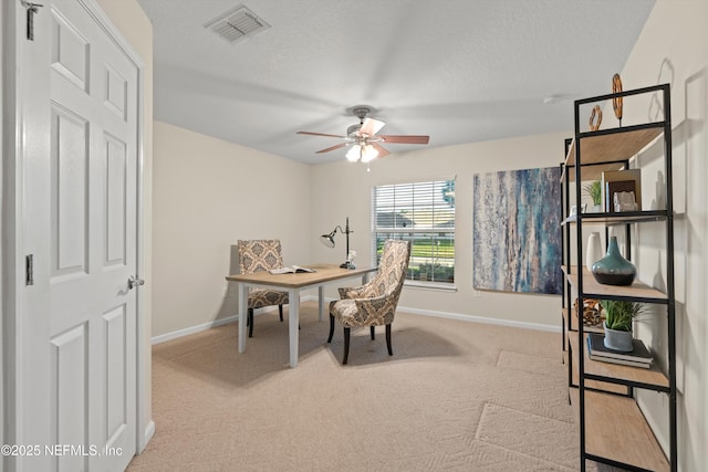 office featuring ceiling fan and light colored carpet