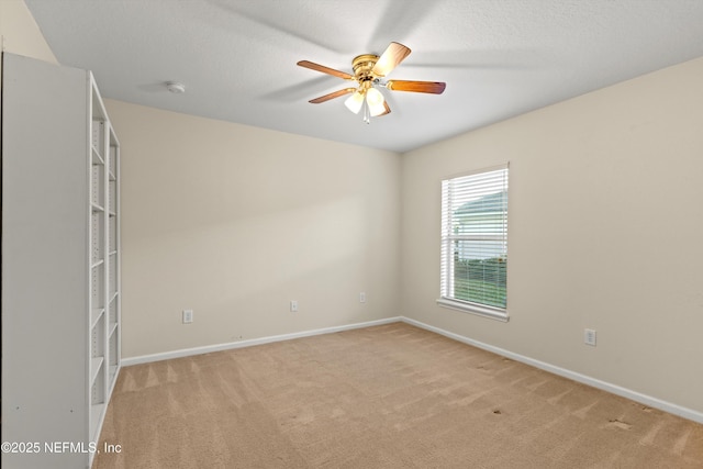 empty room with light carpet and ceiling fan