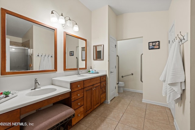 bathroom with toilet, tile patterned floors, an enclosed shower, and vanity