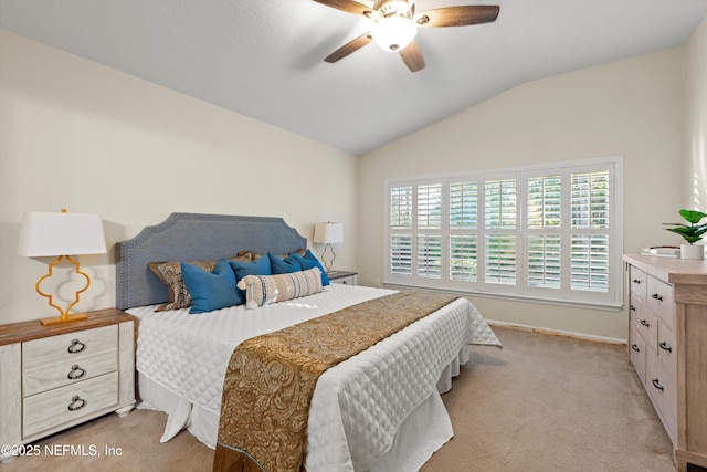 bedroom with ceiling fan, light carpet, and lofted ceiling