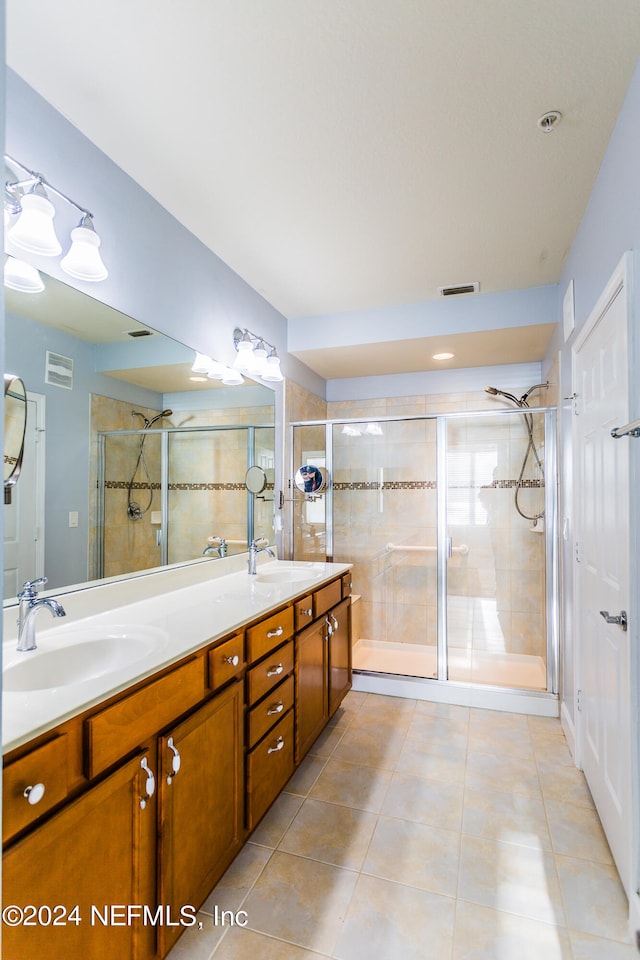 bathroom featuring vanity, walk in shower, and tile patterned floors