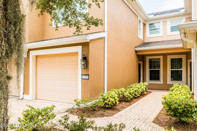 property entrance with a garage