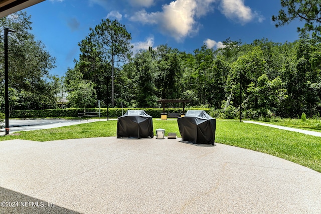 view of patio featuring a grill