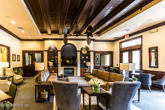 carpeted living room with wood ceiling, beam ceiling, and ornamental molding