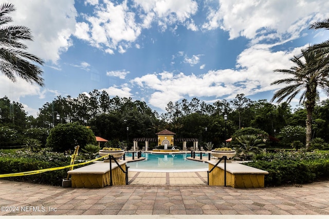11789 Surfbird Cir Unit 6F, Jacksonville, FL 32256 - community pool with a jacuzzi and a patio