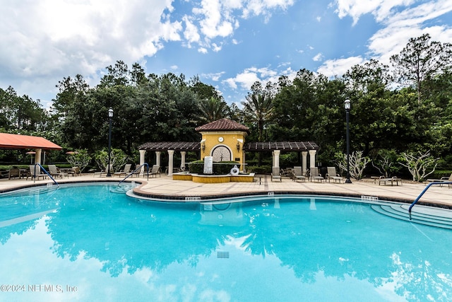 11789 Surfbird Cir Unit 6F, Jacksonville, FL 32256 - community pool featuring a patio area and a pergola