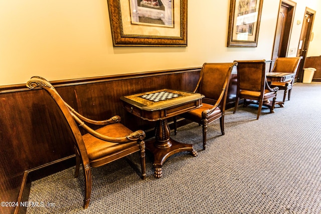 11789 Surfbird Cir Unit 6F, Jacksonville, FL 32256 - sitting room with wooden walls, wainscoting, and carpet floors