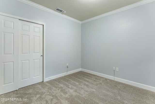 11789 Surfbird Cir Unit 6F, Jacksonville, FL 32256 - unfurnished bedroom featuring visible vents, baseboards, ornamental molding, and carpet flooring