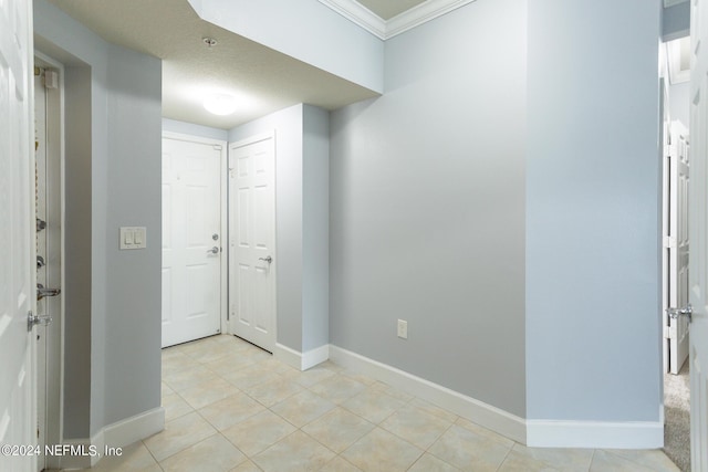 11789 Surfbird Cir Unit 6F, Jacksonville, FL 32256 - interior space with crown molding, light tile patterned floors, and baseboards