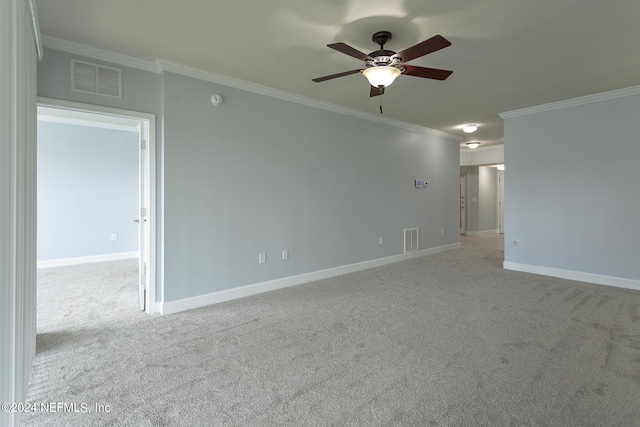 11789 Surfbird Cir Unit 6F, Jacksonville, FL 32256 - spare room featuring visible vents, light carpet, baseboards, and crown molding