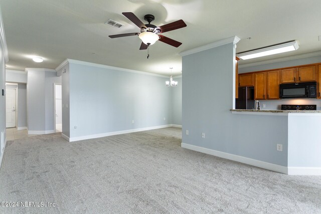 unfurnished living room featuring crown molding, sink, ceiling fan with notable chandelier, and light colored carpet