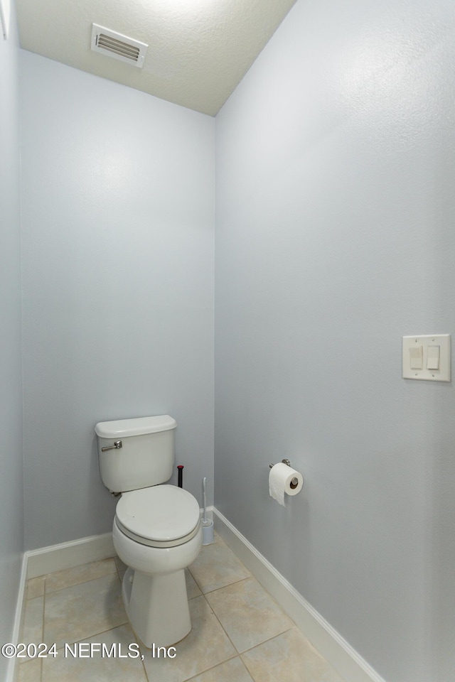 11789 Surfbird Cir Unit 6F, Jacksonville, FL 32256 - bathroom featuring tile patterned flooring, visible vents, toilet, and baseboards
