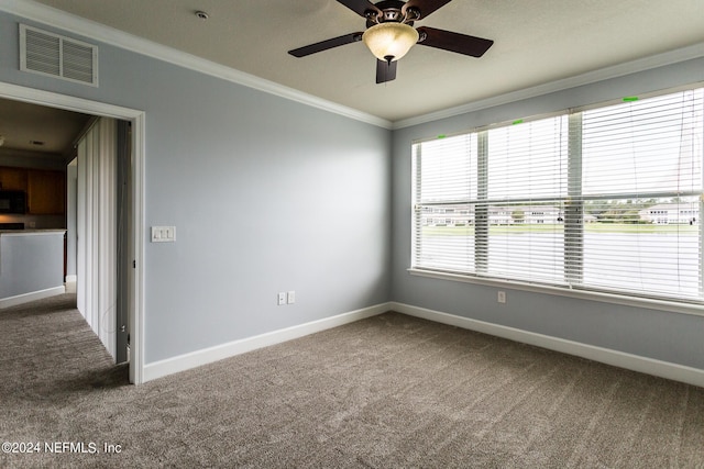 11789 Surfbird Cir Unit 6F, Jacksonville, FL 32256 - carpeted spare room with visible vents, ceiling fan, baseboards, and ornamental molding