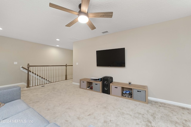 living room with ceiling fan and carpet floors