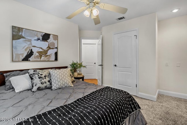 carpeted bedroom with ceiling fan