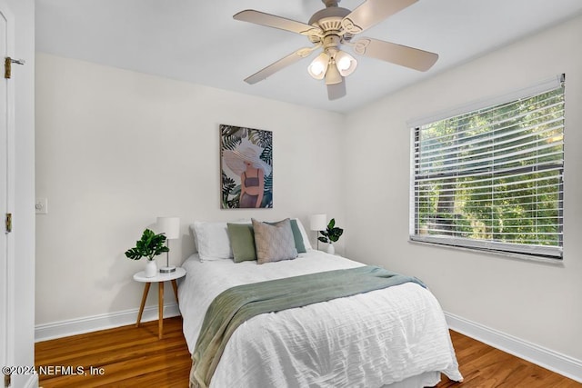 bedroom featuring hardwood / wood-style floors and ceiling fan