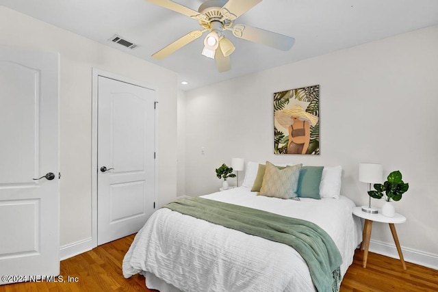 bedroom with hardwood / wood-style flooring and ceiling fan