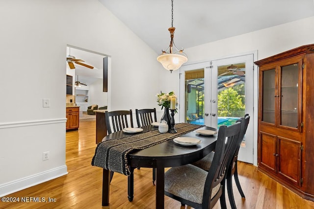 dining space with light hardwood / wood-style floors, lofted ceiling, ceiling fan, and french doors