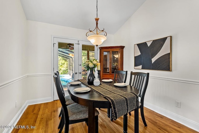 dining area with light hardwood / wood-style flooring and french doors