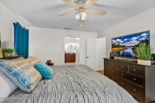 bedroom with connected bathroom and ceiling fan