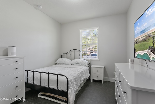 bedroom featuring baseboards