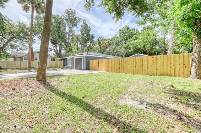 view of yard with a garage