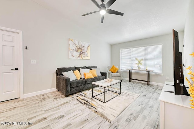 living room featuring ceiling fan and light hardwood / wood-style floors