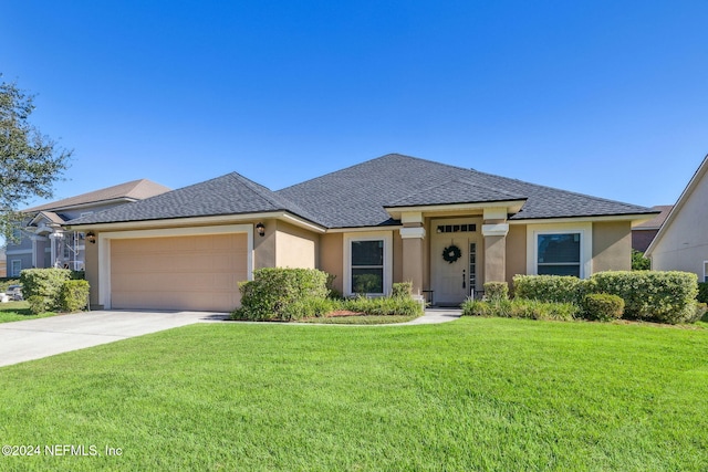 prairie-style house with a garage and a front yard