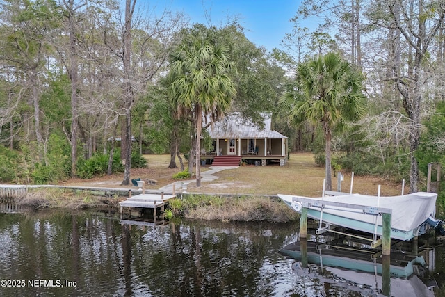 dock area featuring a water view and boat lift