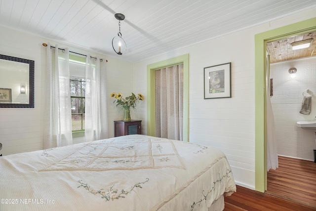 bedroom featuring wooden ceiling and dark wood finished floors