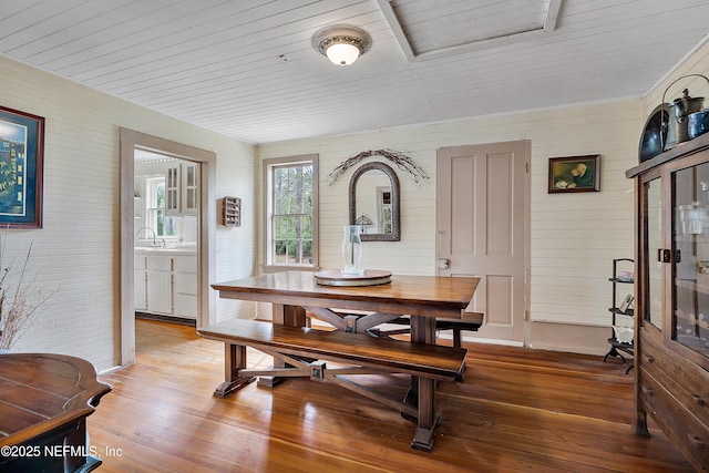 dining area with hardwood / wood-style floors and wood ceiling