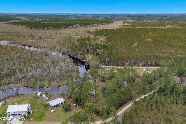 bird's eye view featuring a water view and a view of trees