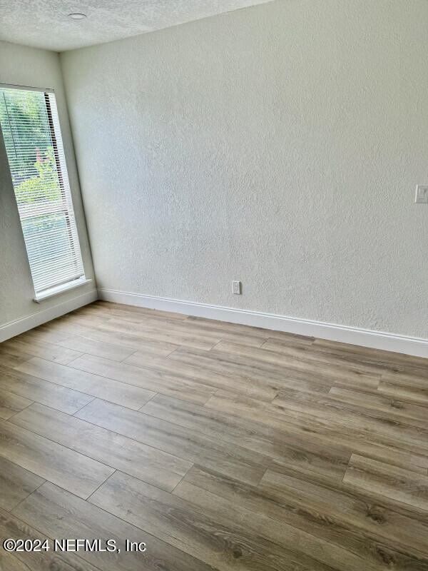 spare room featuring light hardwood / wood-style flooring