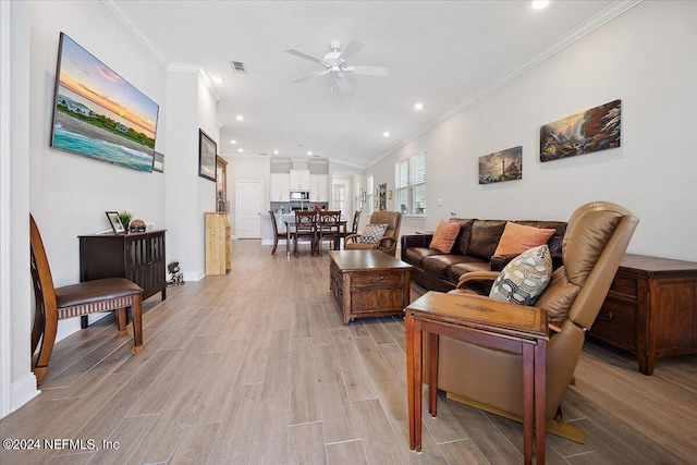 living room with ceiling fan, light hardwood / wood-style floors, and ornamental molding